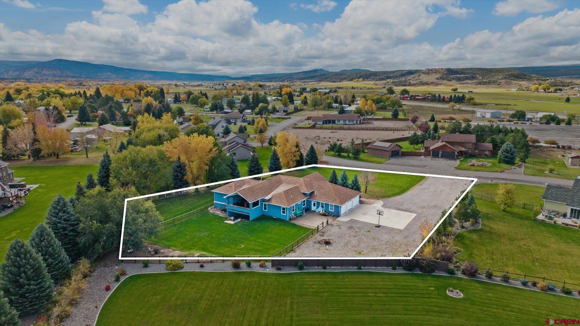 20866 Trophy Road Montrose, CO 81403 - Photo 2 of 29 an aerial view of a swimming pool with a yard