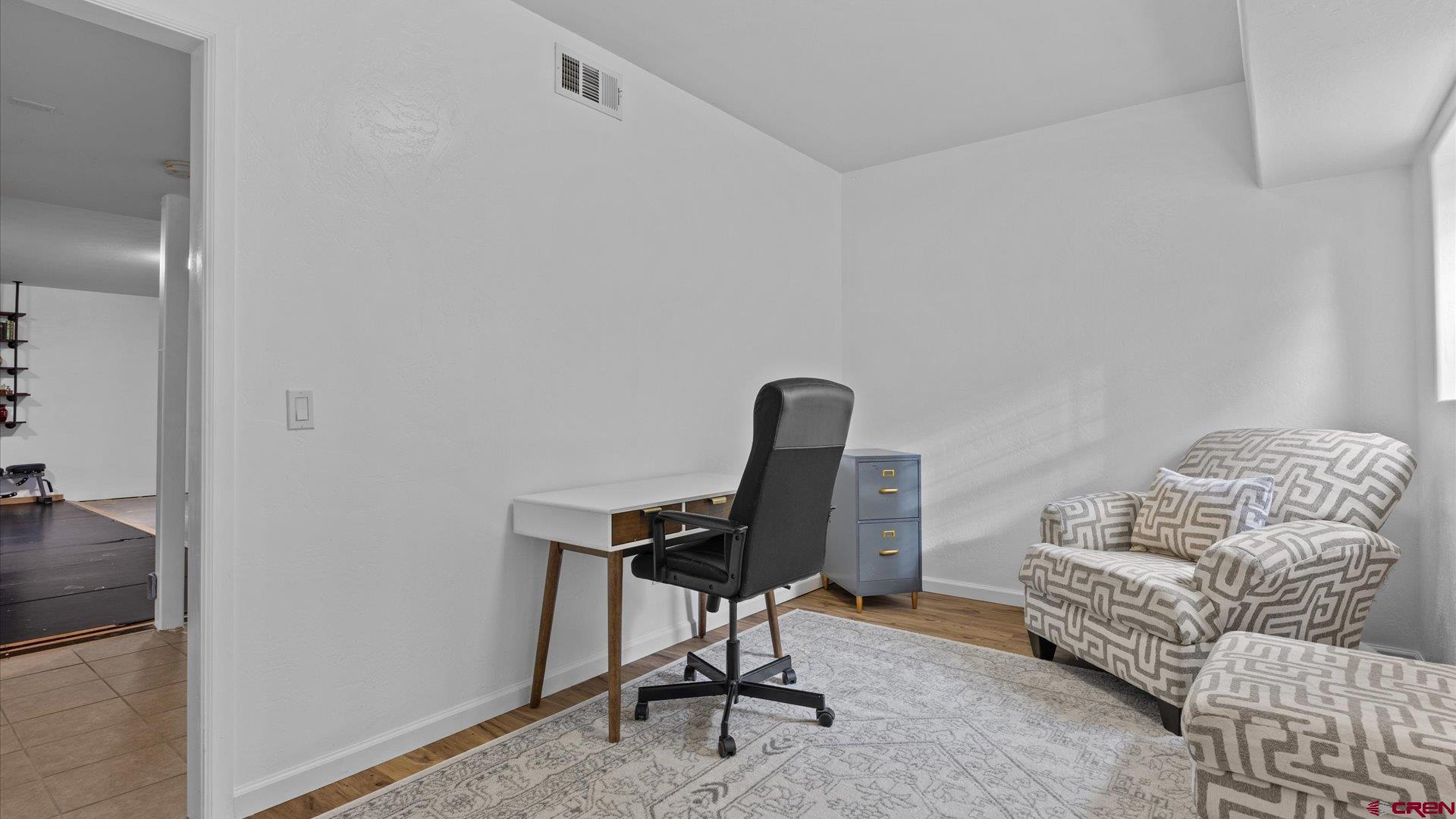 20866 Trophy Road Montrose, CO 81403 - Photo 21 of 29 a view of a workspace with furniture and a window