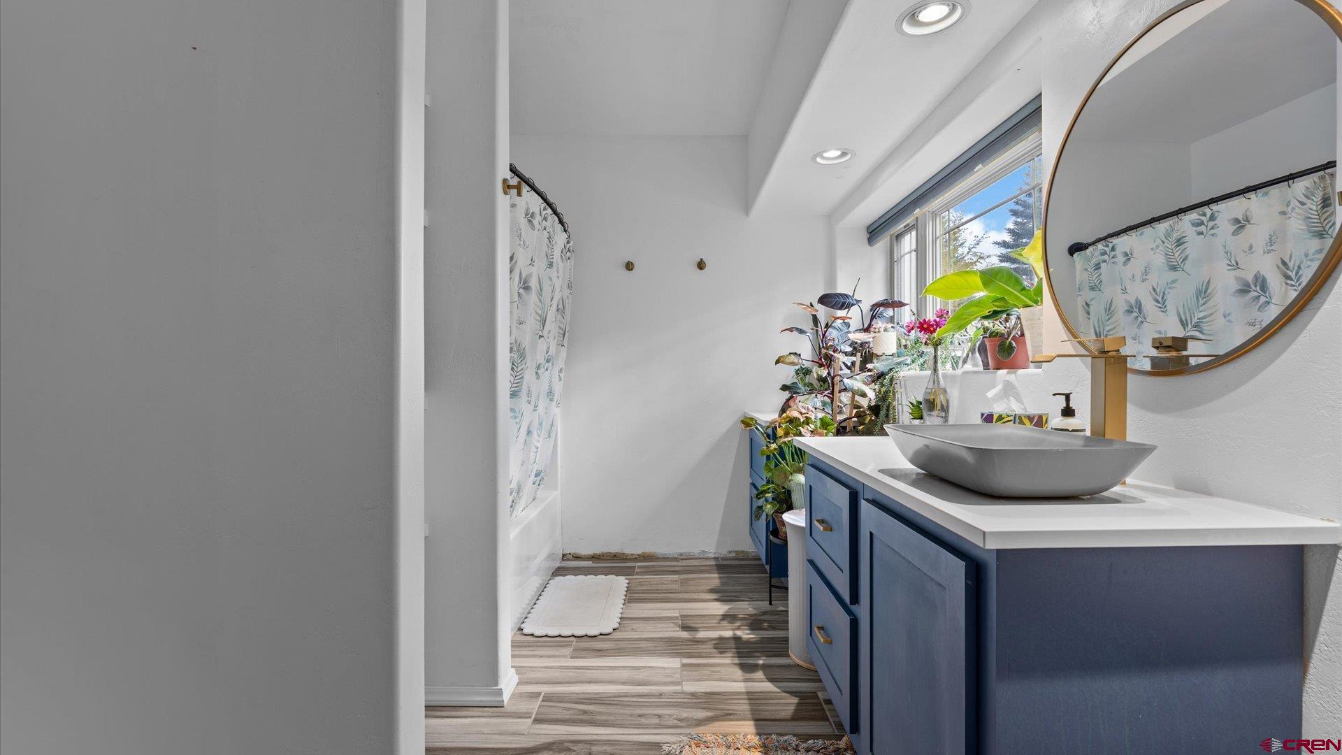 20866 Trophy Road Montrose, CO 81403 - Photo 22 of 29 a view of bathroom with a sink and mirror