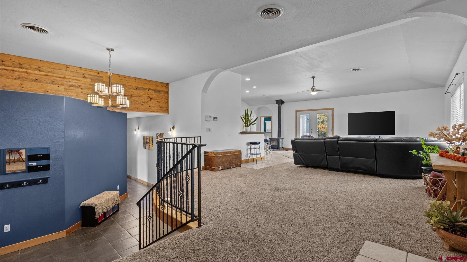 20866 Trophy Road Montrose, CO 81403 - Photo 4 of 29 a living room with furniture and a flat screen tv