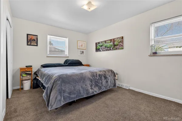 a room with wooden floor and pool table