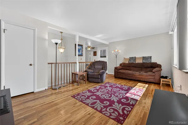 a living room with furniture and a rug