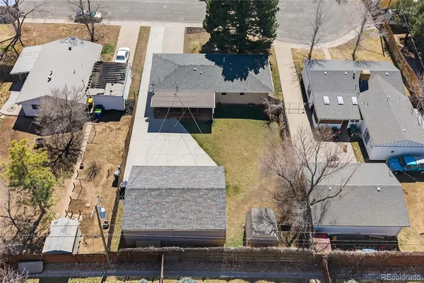 an aerial view of a residential houses with outdoor space