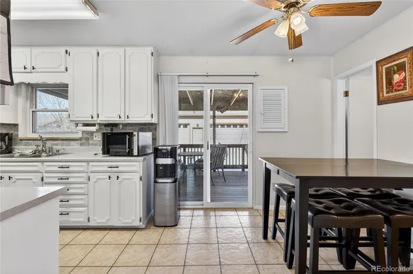a kitchen with stainless steel appliances kitchen island granite countertop a stove a sink and a refrigerator