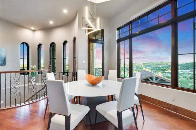 a view of a dining room with furniture window and wooden floor