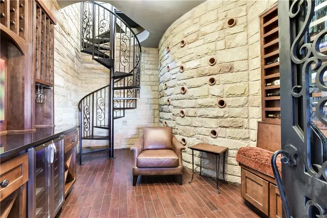 a view of a chairs and wooden floor