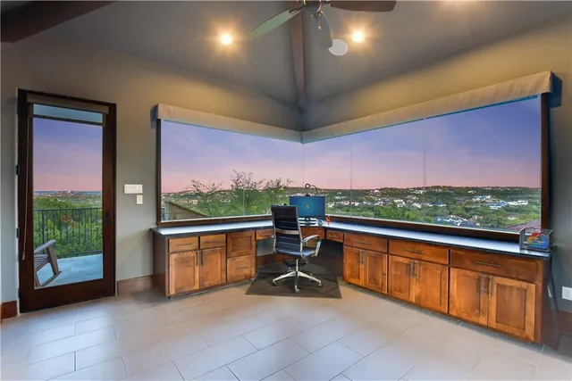 a view of a chairs and table in a balcony