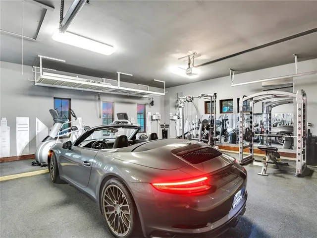 a view of parking garage with cars parked