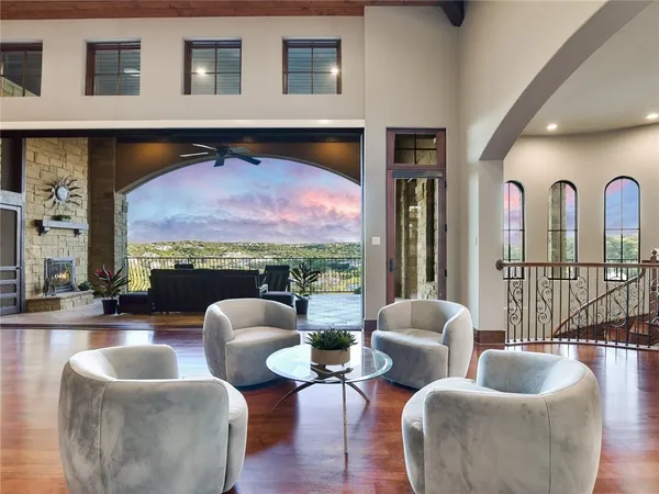 a living room with furniture and a floor to ceiling window
