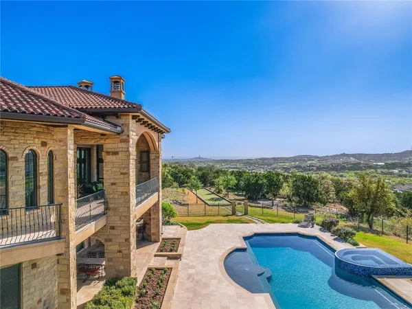 a view of a swimming pool with a patio