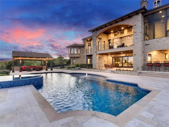 a swimming pool with outdoor seating