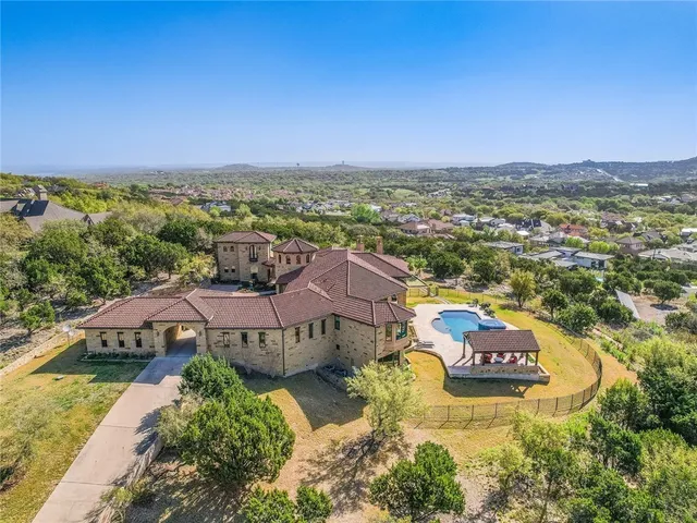 an aerial view of a house with a garden