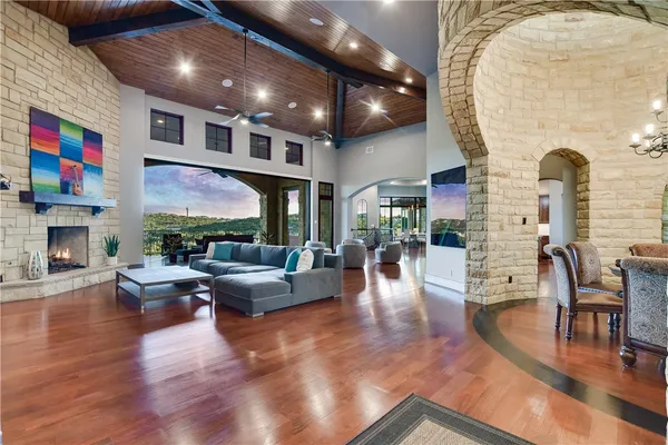 a living room with fireplace furniture and a flat screen tv