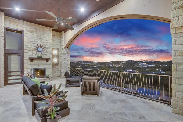 a view of a patio with a table and chairs