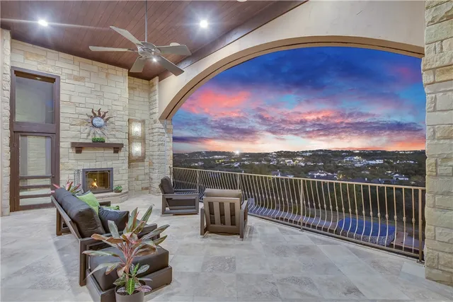 a view of a patio with a table and chairs