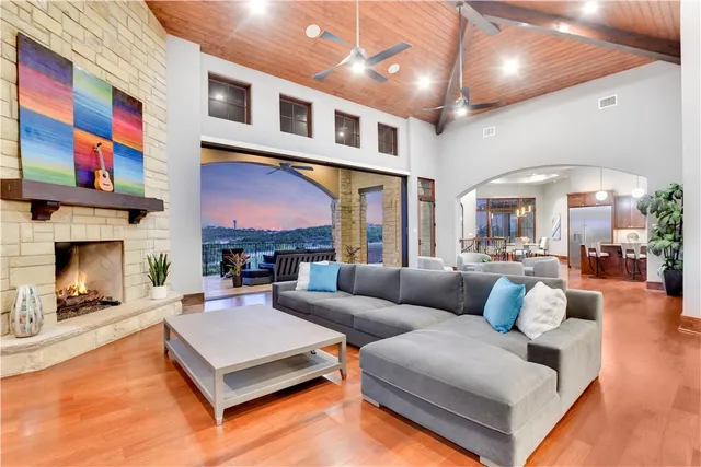 a living room with furniture and a fireplace
