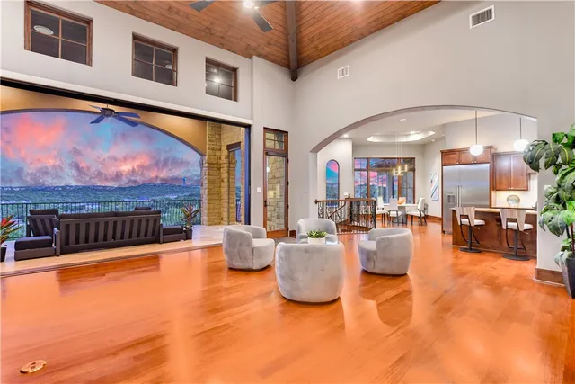 a living room with fireplace furniture and a flat screen tv