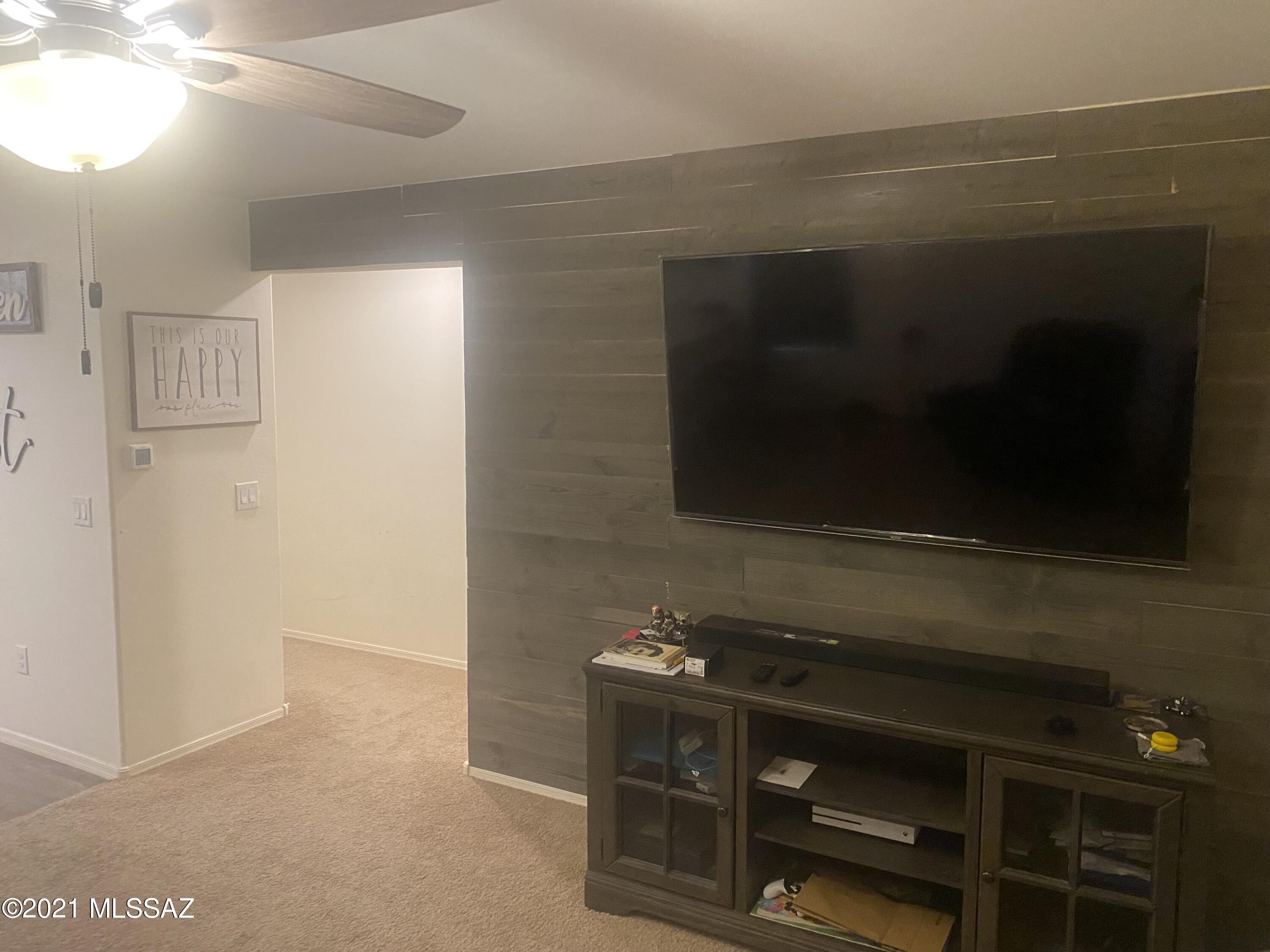 5992 South Antrim Loop Tucson, AZ 85706 - Photo 6 of 15 a room with a stove and a microwave