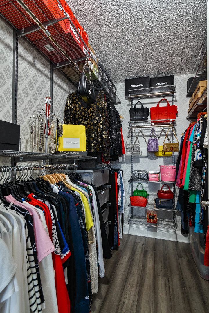 1389 Perry Street, Unit 303 Des Plaines, IL 60016 - Photo 17 of 25 a view of walk in closet with clothes and shoes