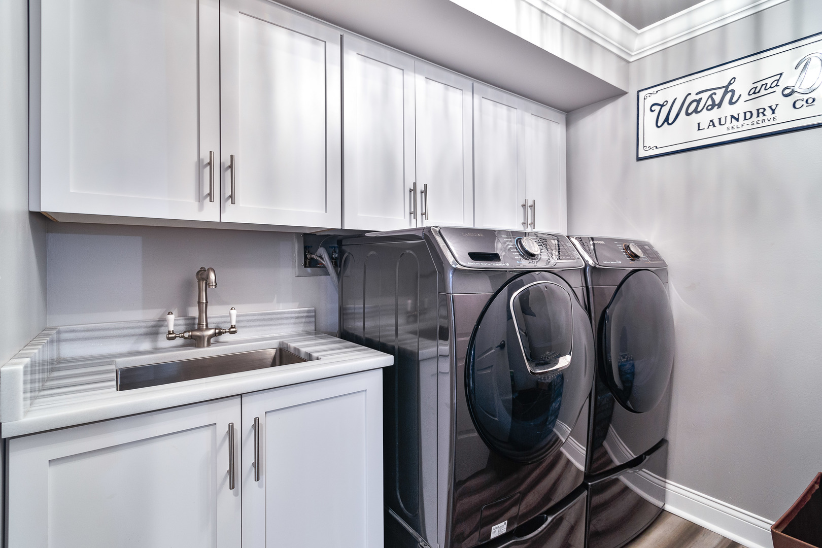 1389 Perry Street, Unit 303 Des Plaines, IL 60016 - Photo 22 of 25 a utility room with sink dryer and washer