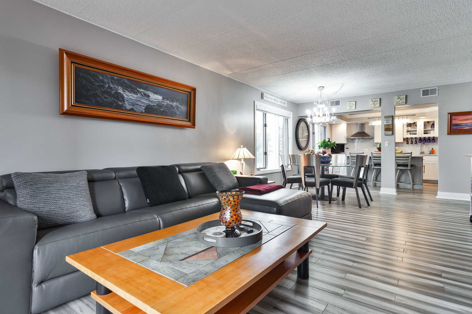 1389 Perry Street, Unit 303 Des Plaines, IL 60016 - Photo 5 of 25 a living room with furniture a dining table and kitchen view