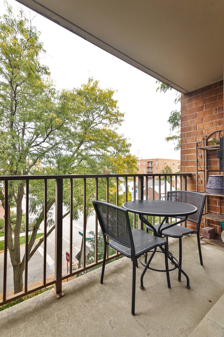 1389 Perry Street, Unit 303 Des Plaines, IL 60016 - Photo 7 of 25 a view of a chairs and table in patio