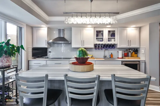 a kitchen with a table and chairs in it