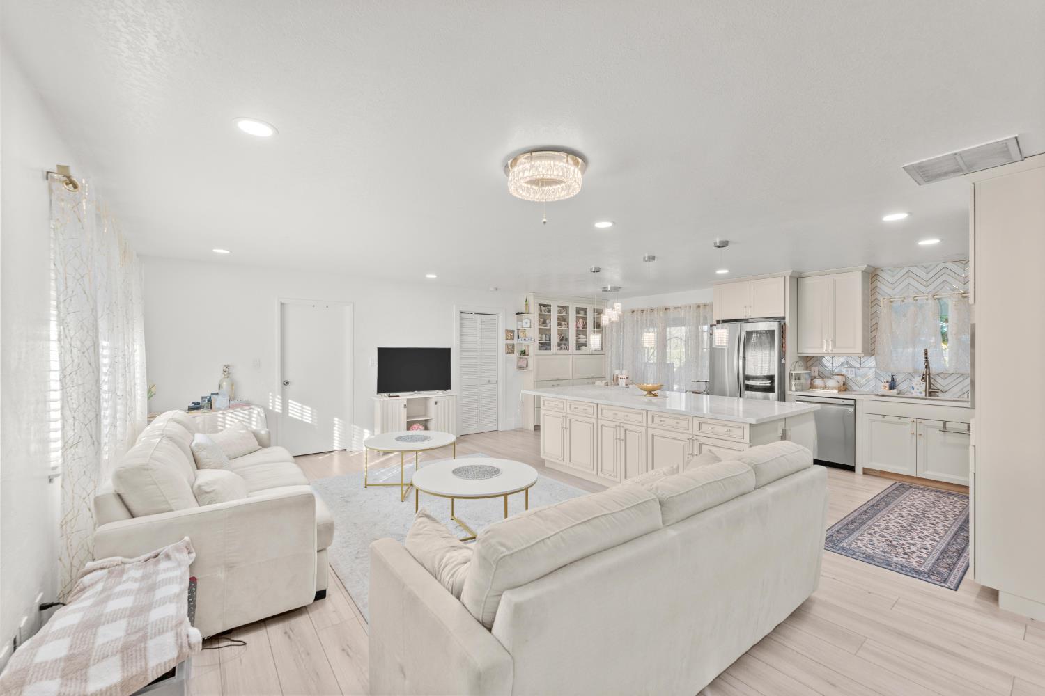 8850 Bader Road Elk Grove, CA 95624 - Photo 11 of 43 a living room with furniture and a table