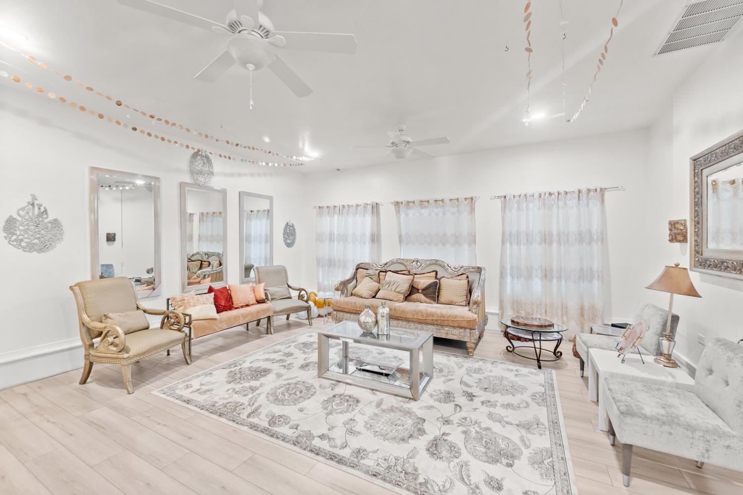8850 Bader Road Elk Grove, CA 95624 - Photo 22 of 43 a living room with furniture and a large window