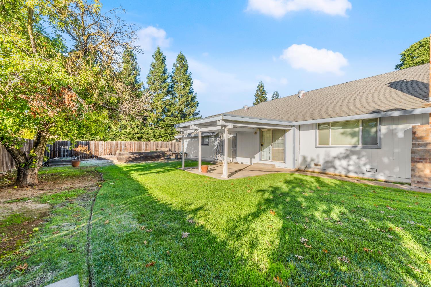 8850 Bader Road Elk Grove, CA 95624 - Photo 34 of 43 a front view of a house with yard patio and green space