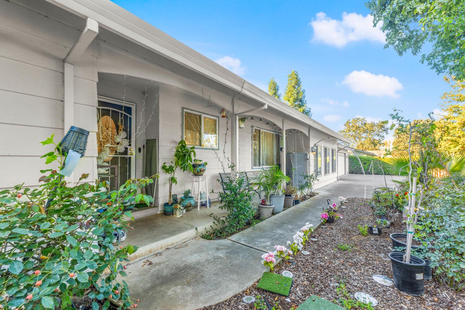 8850 Bader Road Elk Grove, CA 95624 - Photo 8 of 43 a front view of a house with a yard