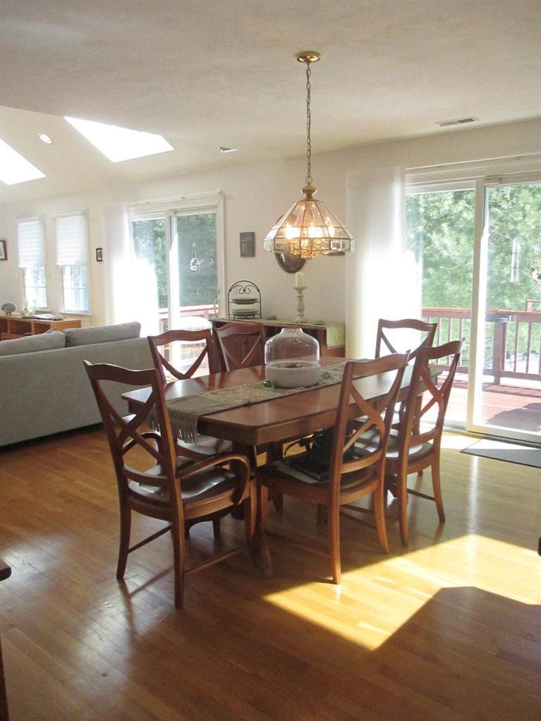 27 Forest Hills Road Cotuit, MA 02635 - Photo 11 of 28 a view of a dining room with furniture window and wooden floor