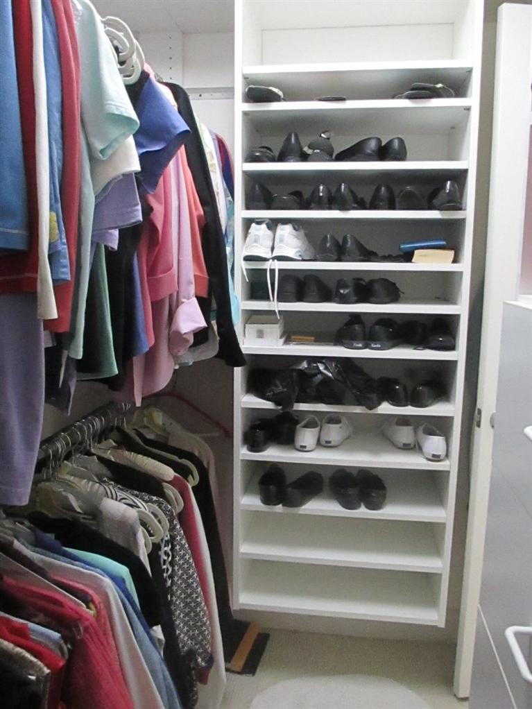 27 Forest Hills Road Cotuit, MA 02635 - Photo 17 of 28 a view of walk in closet with clothes and shoes