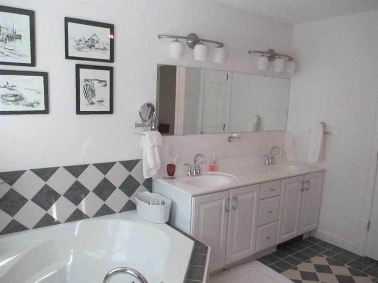 27 Forest Hills Road Cotuit, MA 02635 - Photo 19 of 28 a bathroom with a sink and a mirror