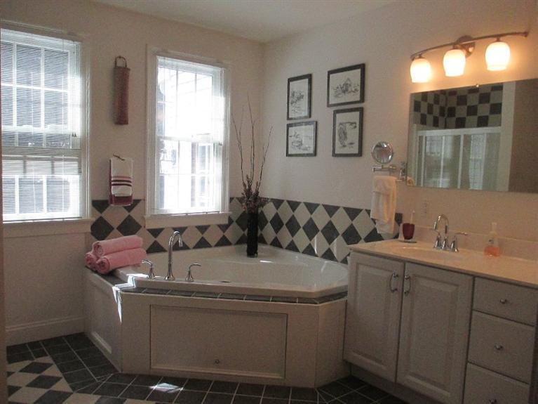 27 Forest Hills Road Cotuit, MA 02635 - Photo 20 of 28 a bathroom with a sink and a mirror