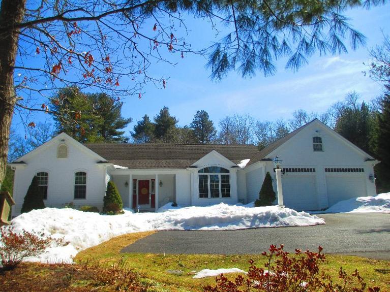 27 Forest Hills Road Cotuit, MA 02635 - Photo 2 of 28 a front view of a house with a yard