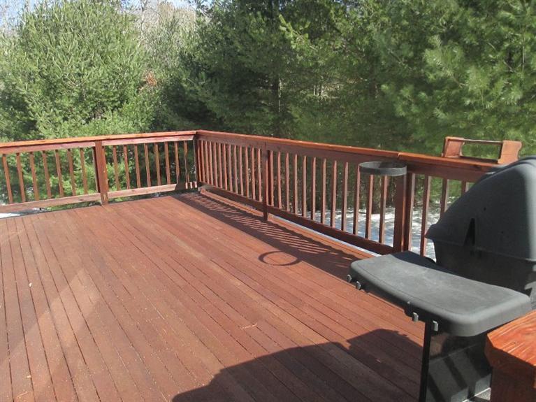 27 Forest Hills Road Cotuit, MA 02635 - Photo 24 of 28 a view of balcony with wooden floor and fence