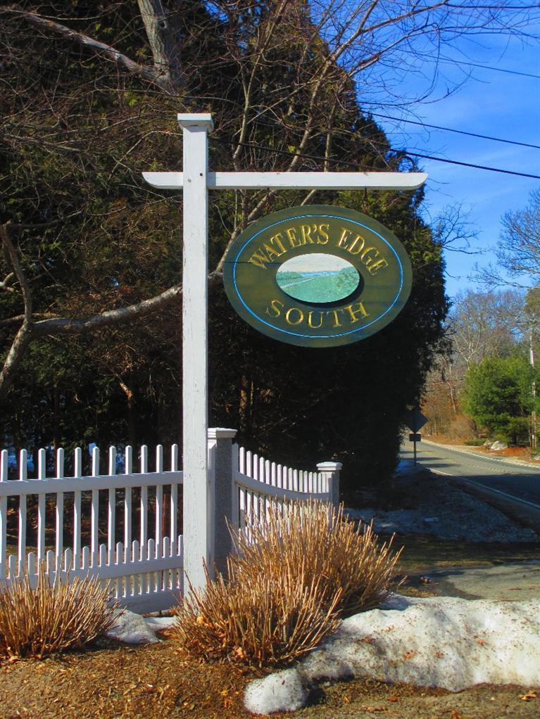 27 Forest Hills Road Cotuit, MA 02635 - Photo 25 of 28 a view of a wooden house with a small yard and wooden floor