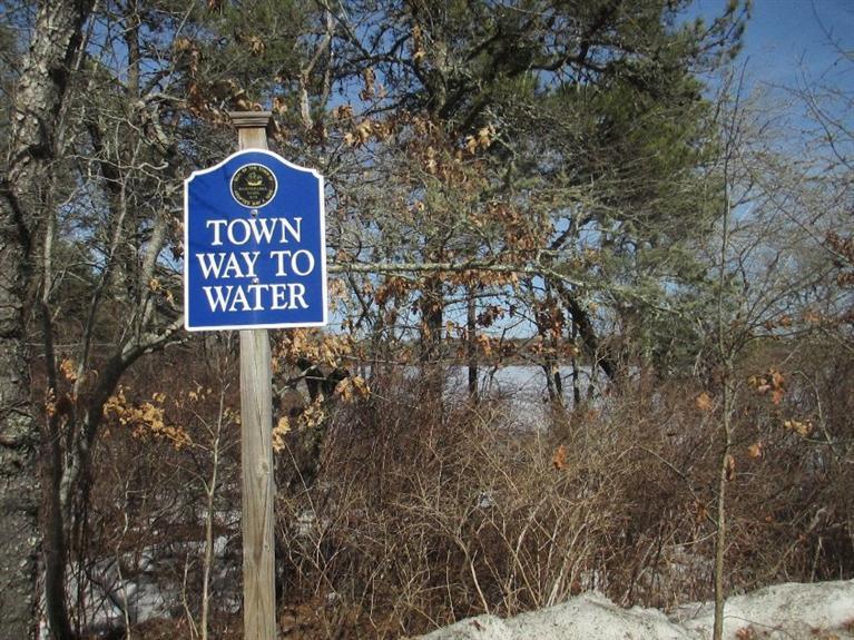 27 Forest Hills Road Cotuit, MA 02635 - Photo 26 of 28 a sign broad on the side of the road