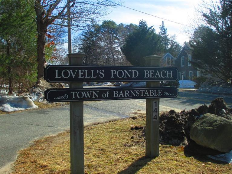 27 Forest Hills Road Cotuit, MA 02635 - Photo 27 of 28 a view of a street sign under a large tree