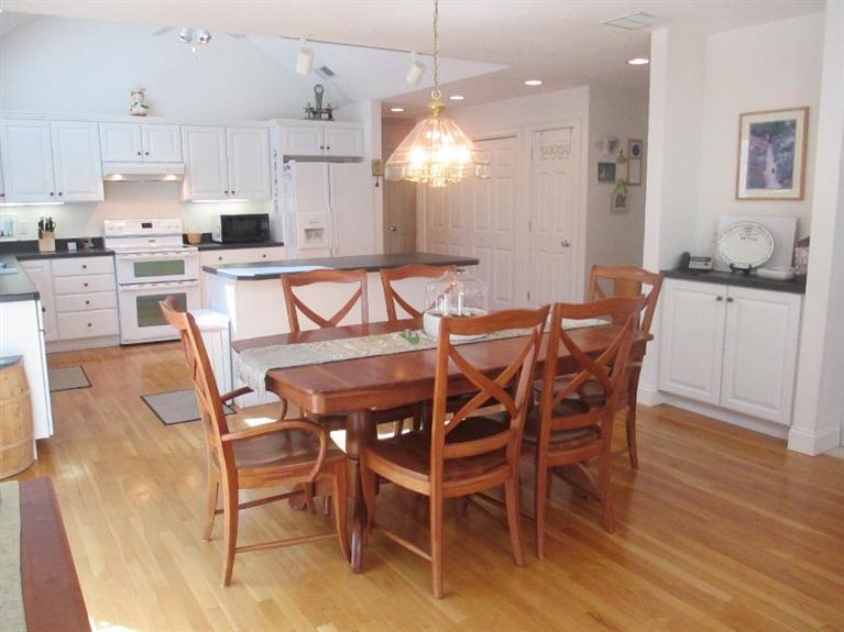 27 Forest Hills Road Cotuit, MA 02635 - Photo 10 of 28 a view of a dining room with furniture and wooden floor