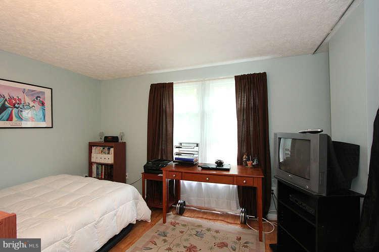1951 Belmont Ridge Court Reston, VA 20191 - Photo 22 of 30 a bedroom with a bed and a window
