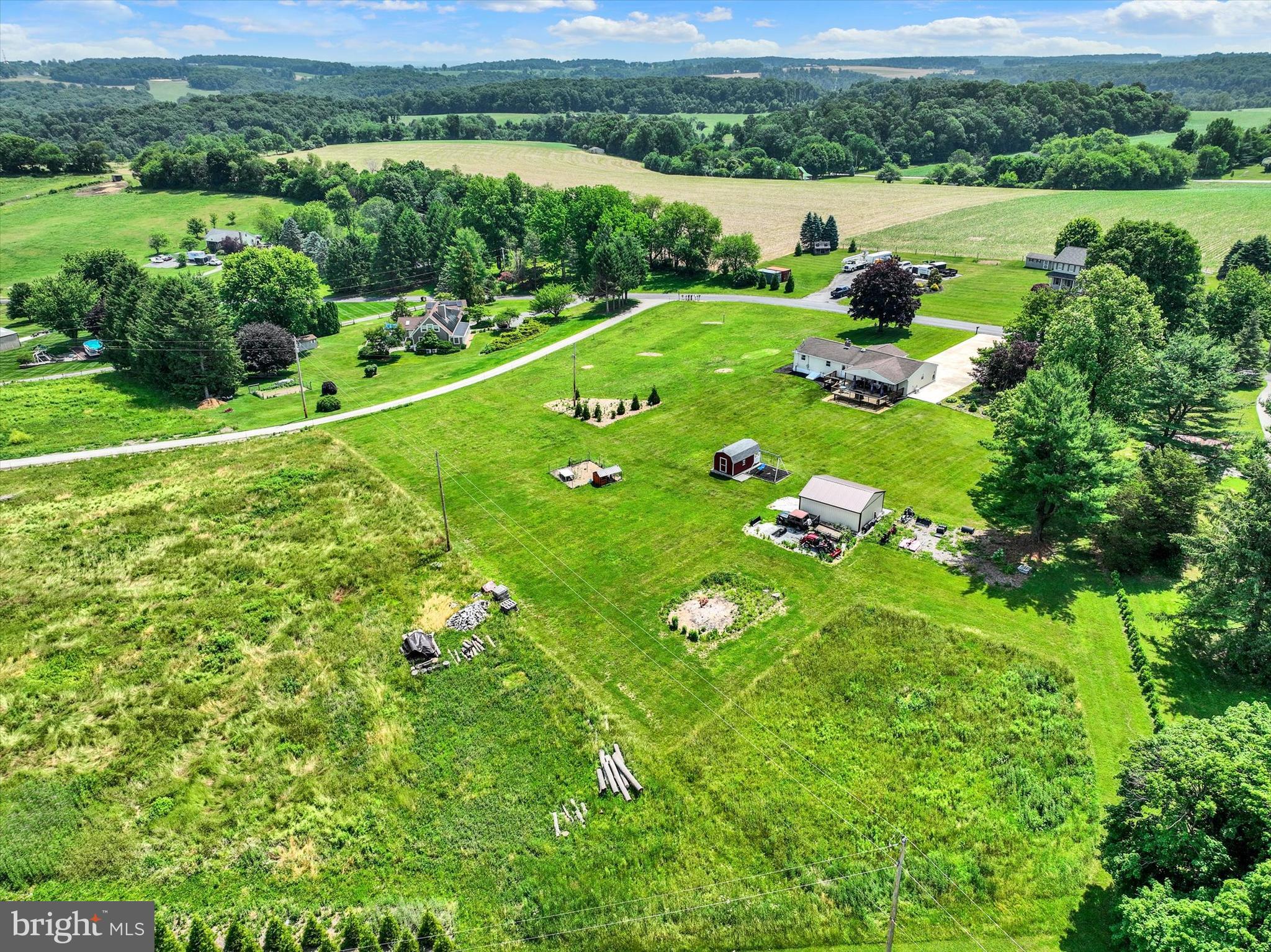 13174 Mont Road Felton, PA 17322 - Photo 17 of 39 an aerial view of green landscape with trees houses and mountain view