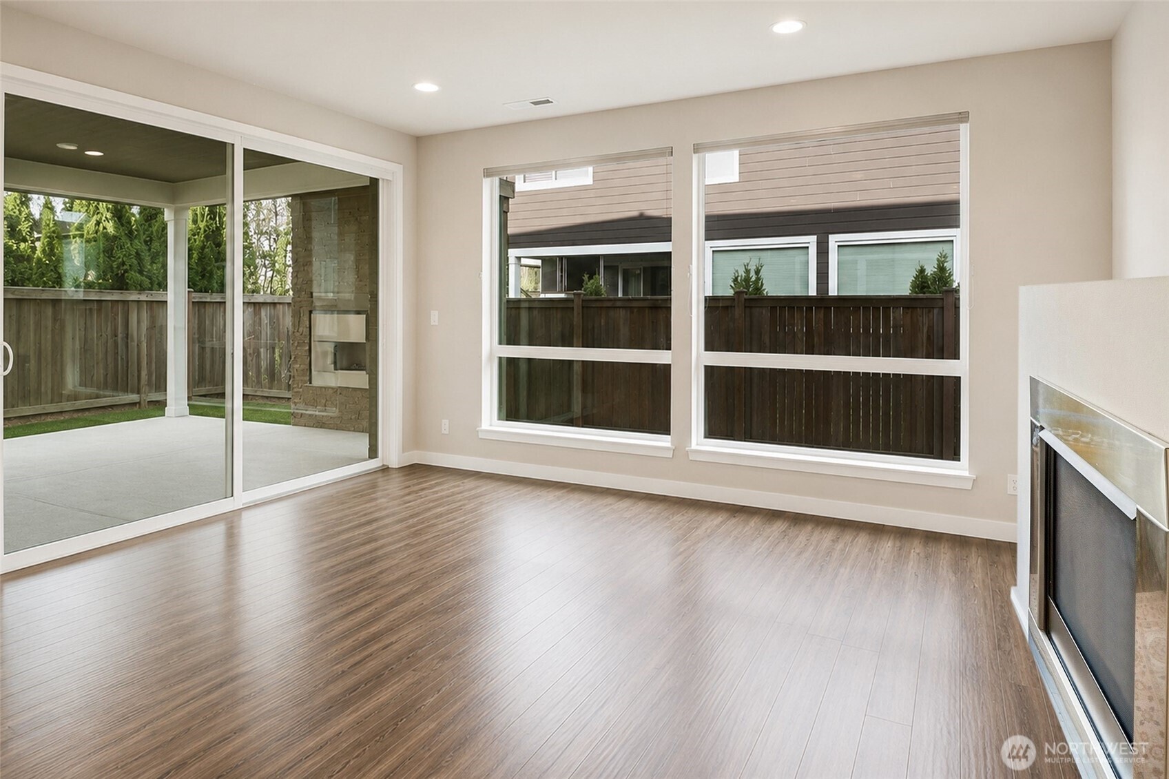17227 39th Drive Southeast Bothell, WA 98012 - Photo 4 of 22 an empty room with wooden floor and windows