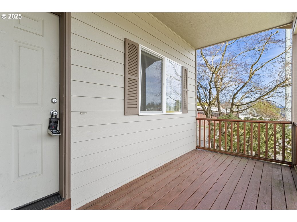 3021 Southeast Pheasant Avenue Gresham, OR 97080 - Photo 2 of 26 a view of an empty room with wooden floor and a window