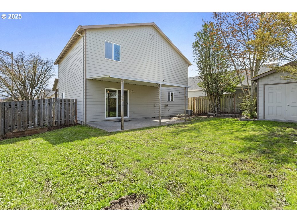 3021 Southeast Pheasant Avenue Gresham, OR 97080 - Photo 24 of 26 a view of a backyard with large trees