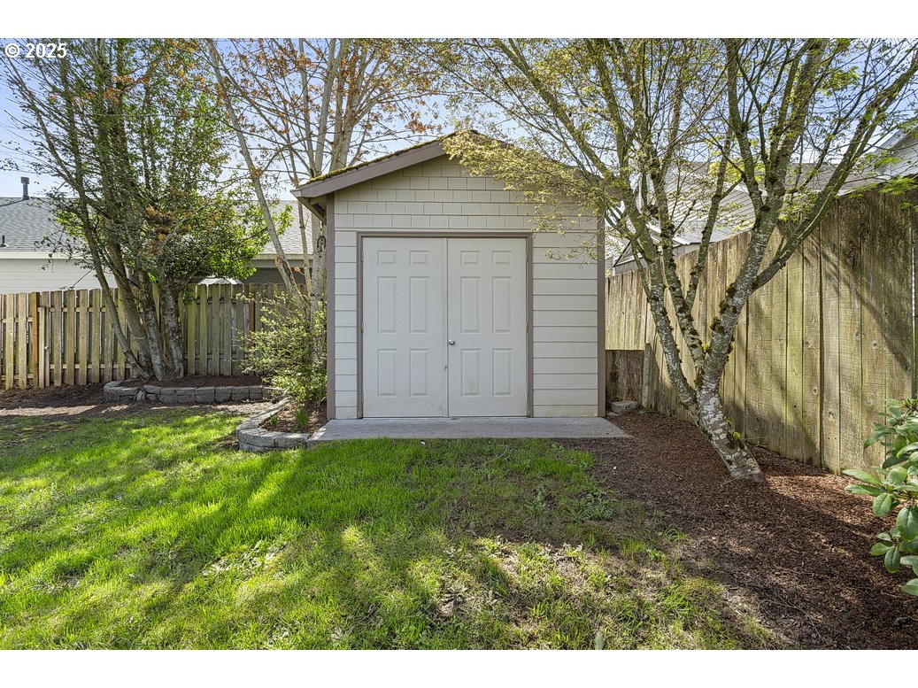 3021 Southeast Pheasant Avenue Gresham, OR 97080 - Photo 25 of 26 a front view of a house with garden