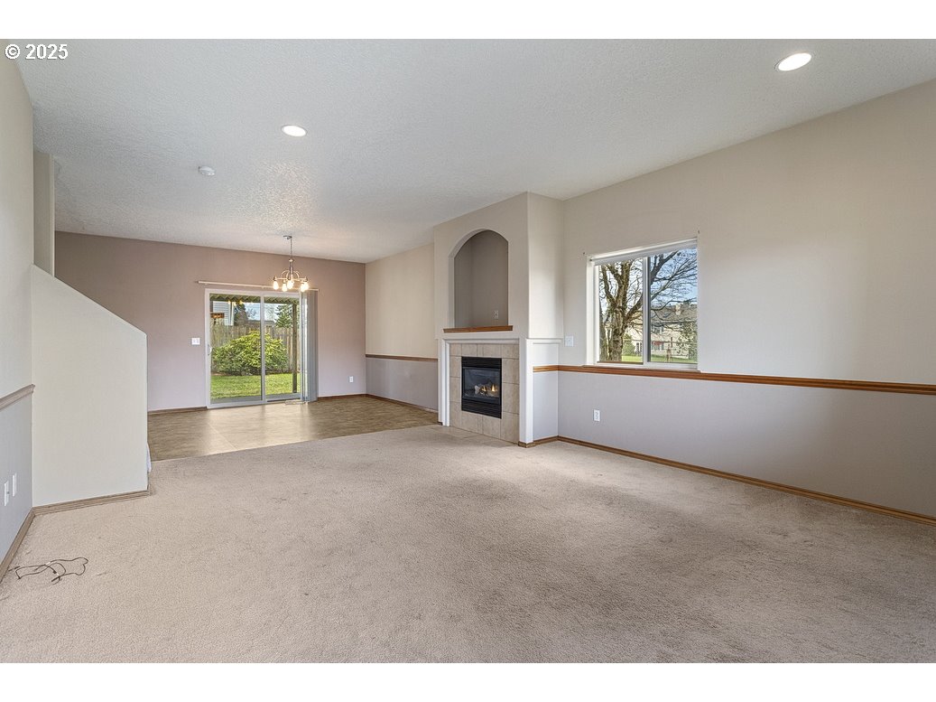3021 Southeast Pheasant Avenue Gresham, OR 97080 - Photo 3 of 26 a view of empty room with a fireplace