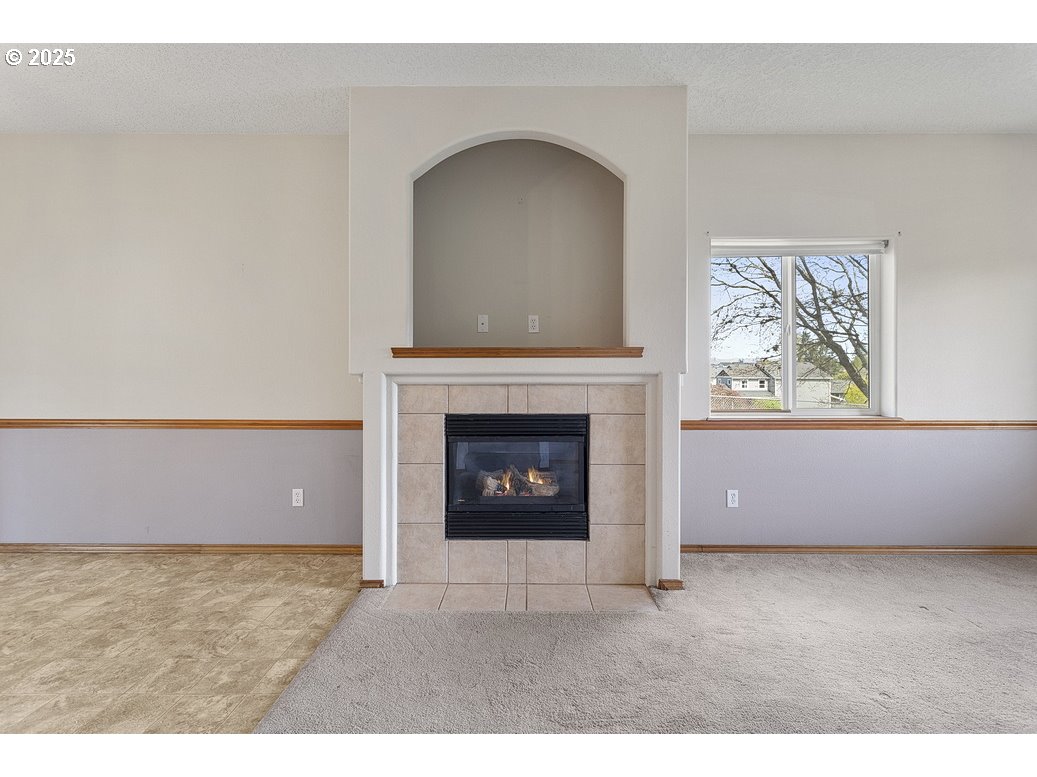 3021 Southeast Pheasant Avenue Gresham, OR 97080 - Photo 5 of 26 a living room with furniture and a fireplace