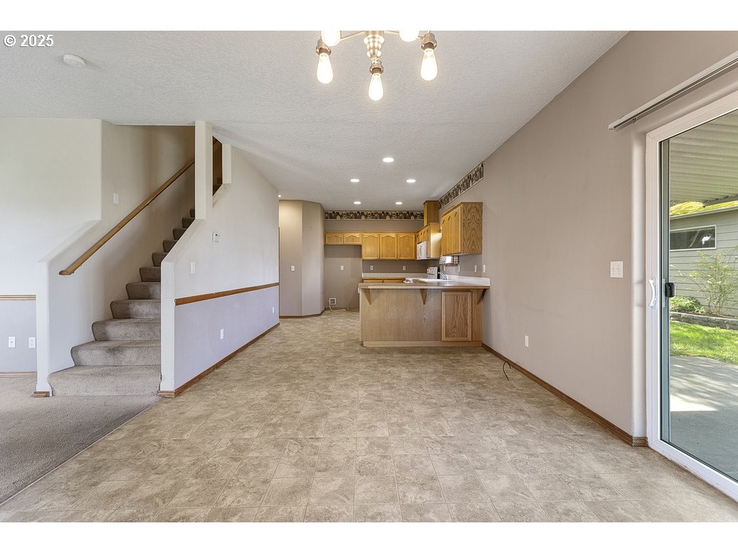 3021 Southeast Pheasant Avenue Gresham, OR 97080 - Photo 8 of 26 a view of a livingroom with kitchen and furniture